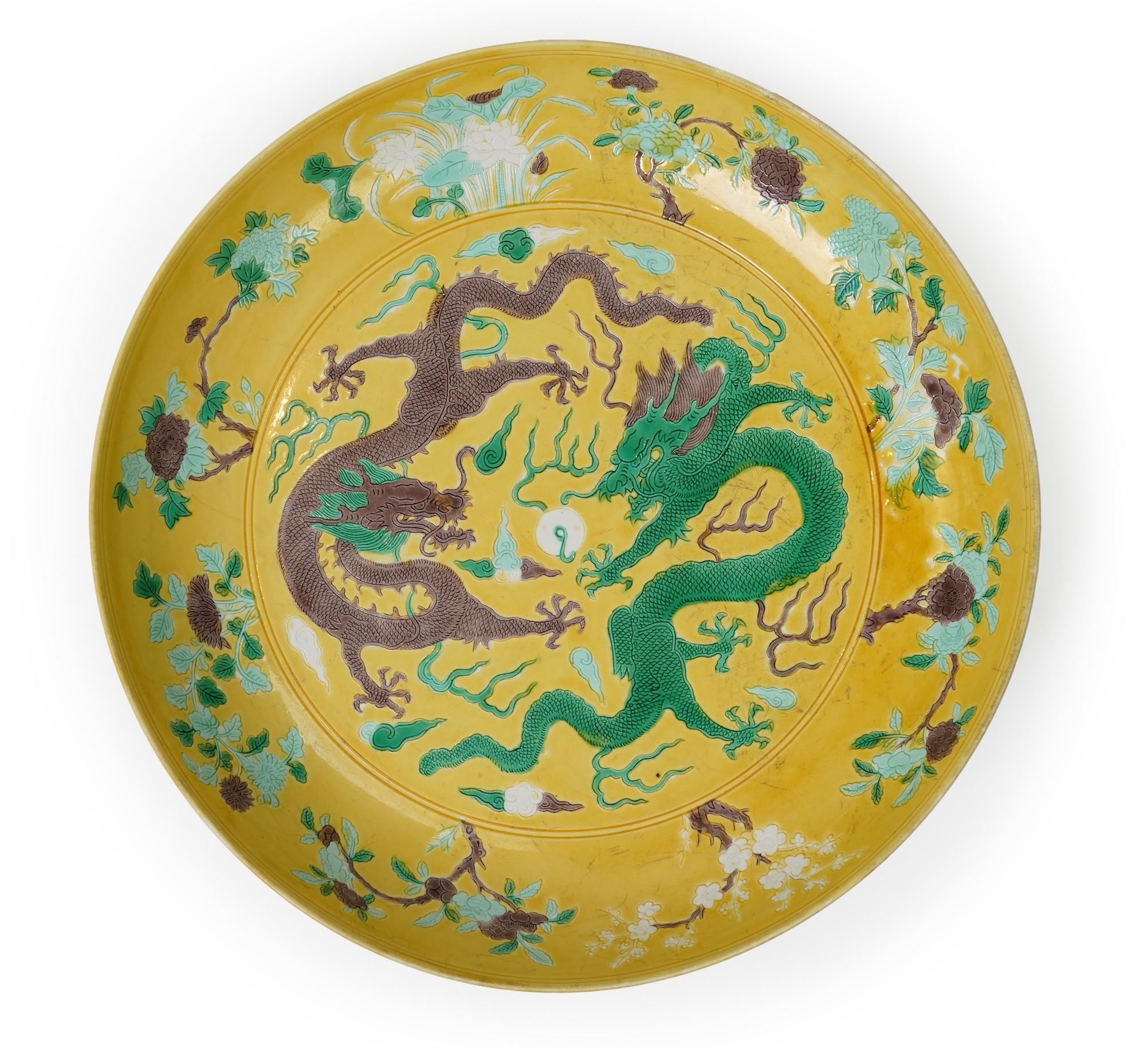 A Chinese yellow, green and aubergine glazed and incised ‘dragon’ dish, chuxiugong zhi hall mark, possibly Guangxu period